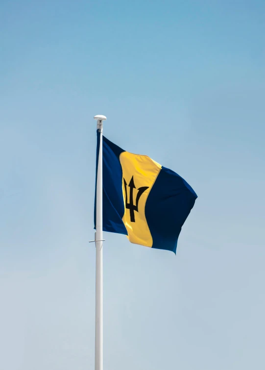 a flag of the navy flying in a blue sky