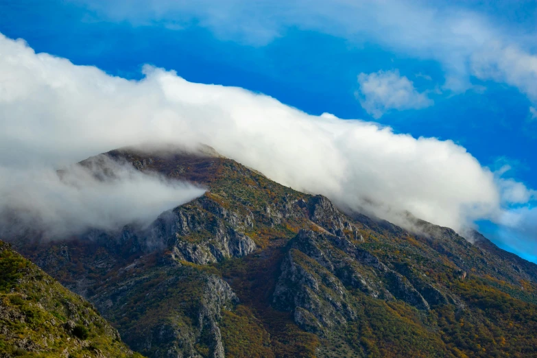 a mountain on a cloudy day with some cloud