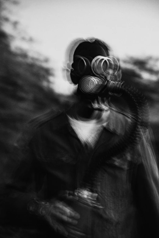 a man in a gas mask with a beard