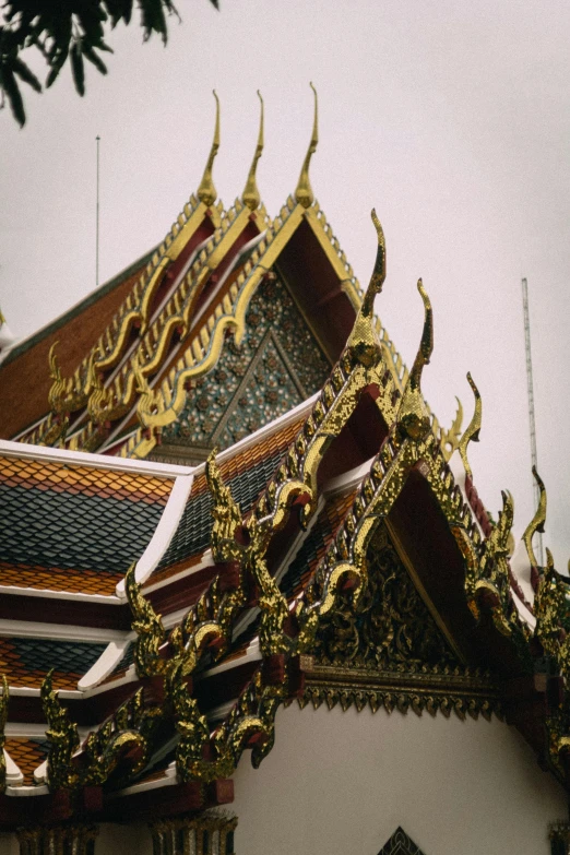 a building with ornate designs in gold, white and red