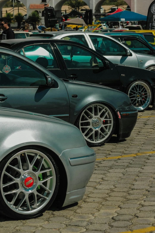 the cars are parked on the pavement in the parking lot