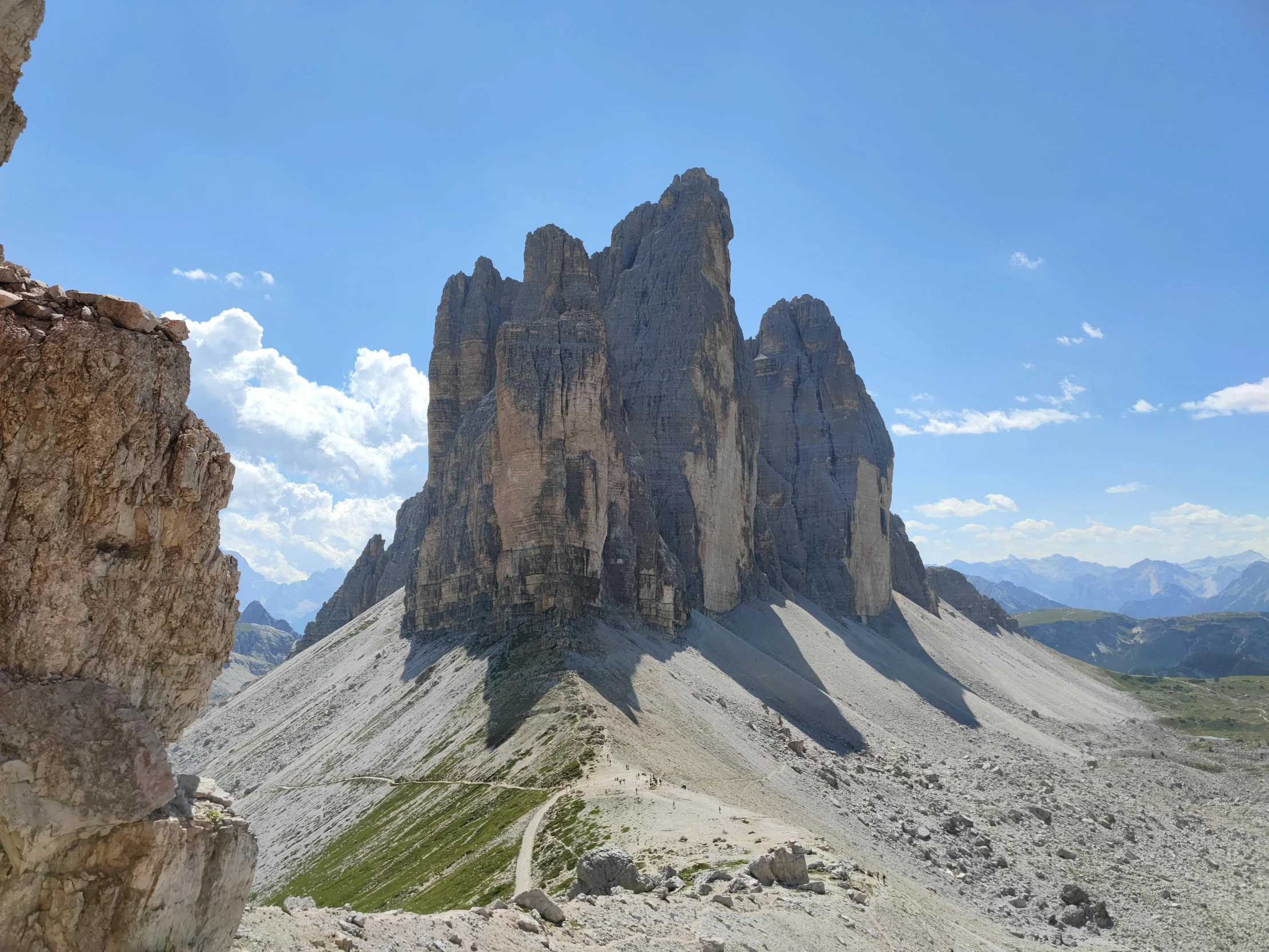 the rocks are very tall and large, in the mountains