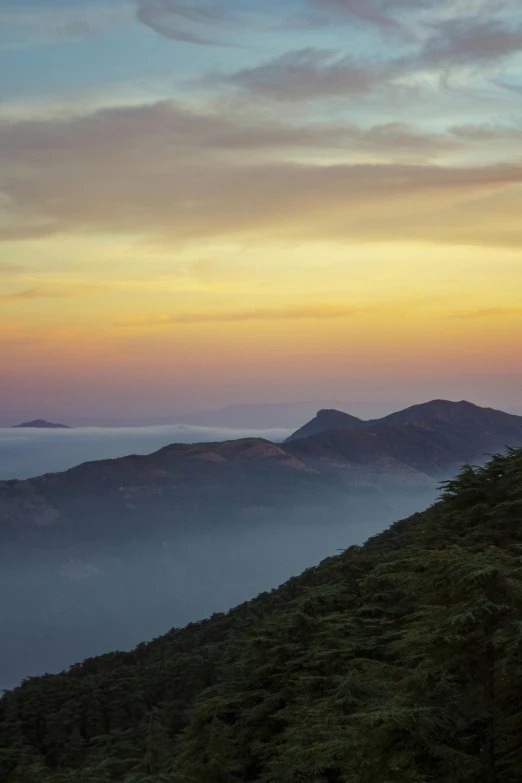 the beautiful mountains are silhouetted by the evening sun