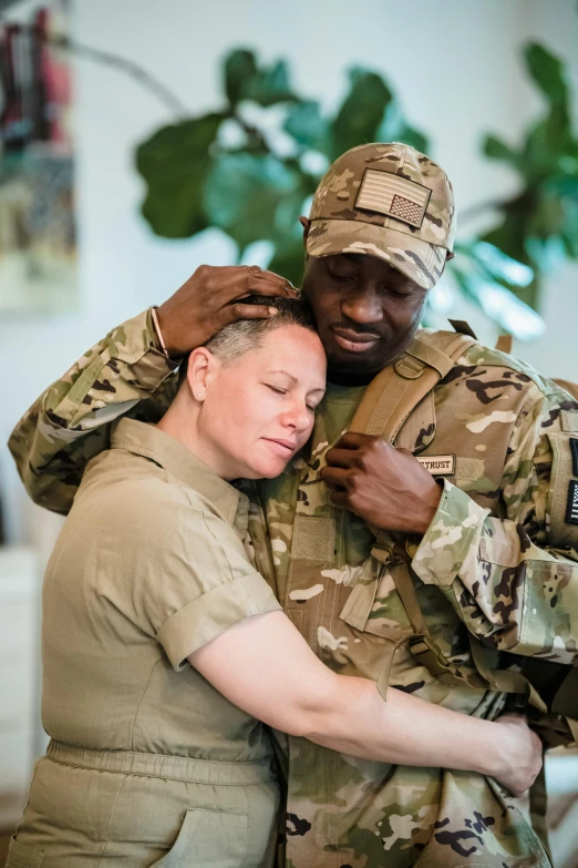 a man is hugging a woman on the other side of him