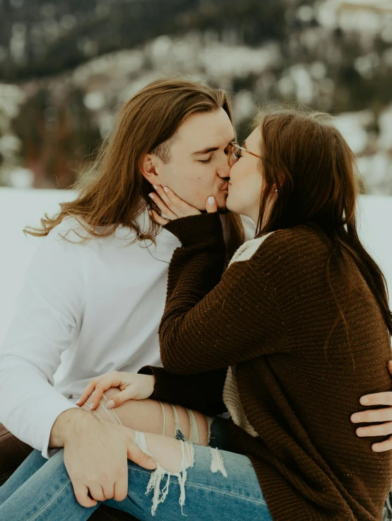 a man and woman are sharing a kiss