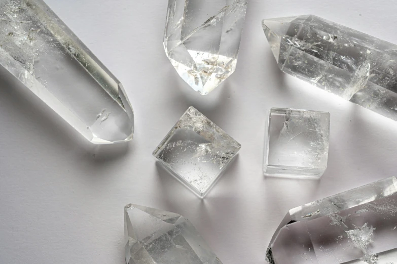 some cut pieces of clear ice sitting on a table