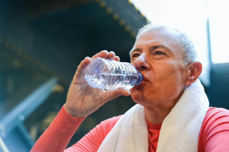 an older lady in the middle of drinking water