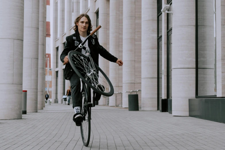 a person riding a bicycle down a street