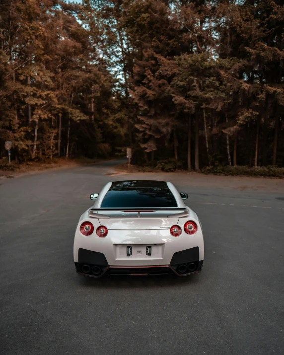 a white sports car parked on a street