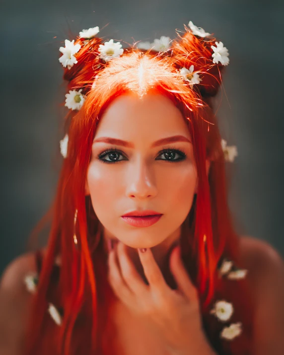 a woman with long red hair and flowers in her hair