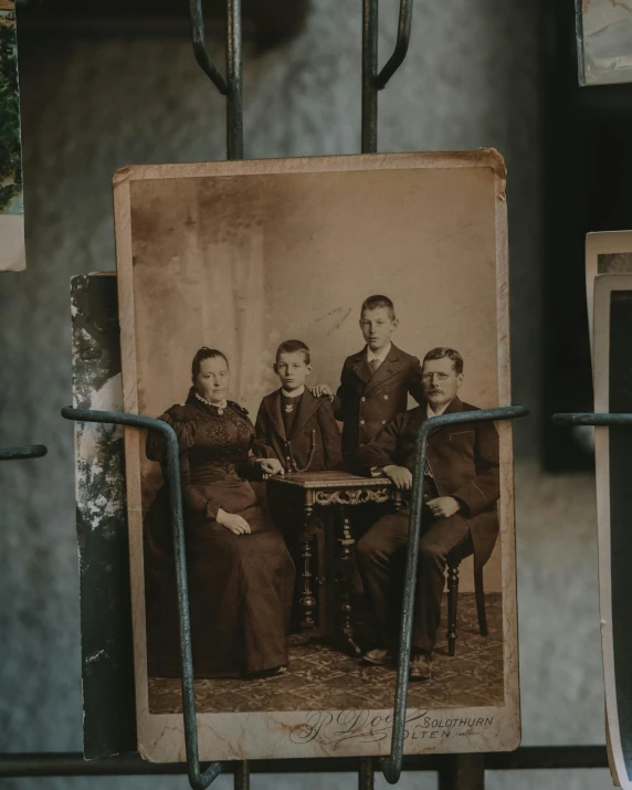 this is an old picture of men sitting in a booth