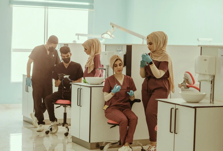 people in an office doing hair care and manicure