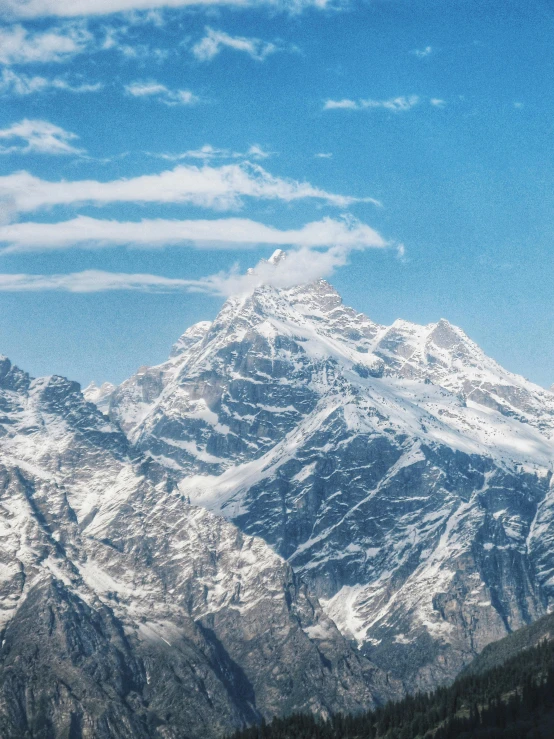 a mountain range with some snow capped mountains