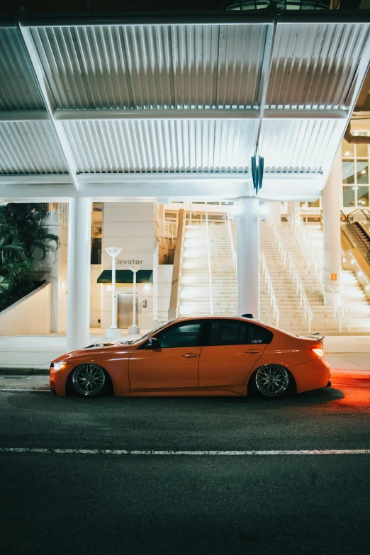 a car sits on a street near a building