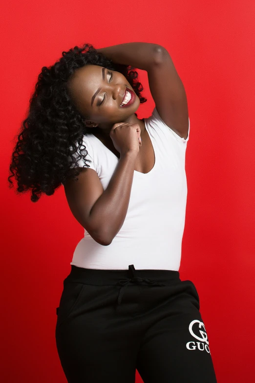 a woman in white shirt and black pants