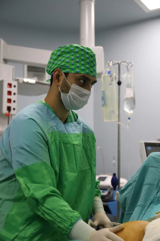 a doctor at work on a patient in the operating room