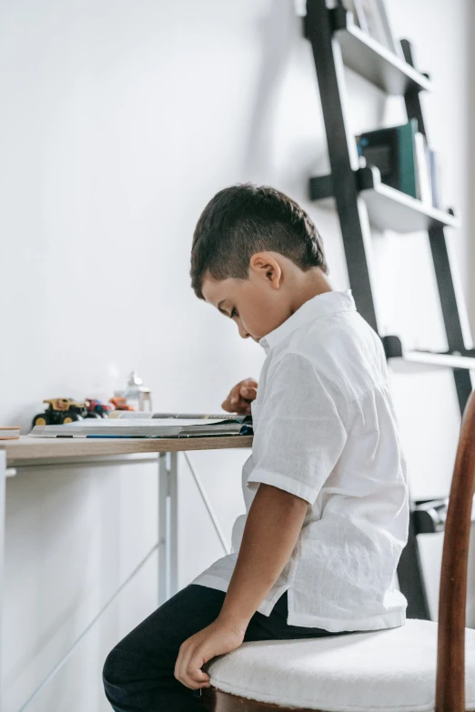 boy at the desk working on his project