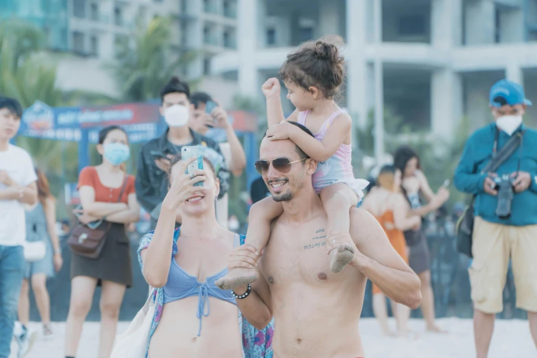 a man and his child are on a beach