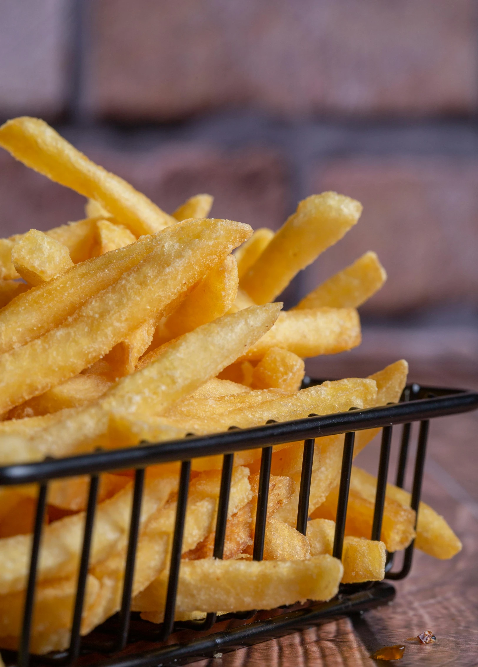 small basket of cheetos in a black basket