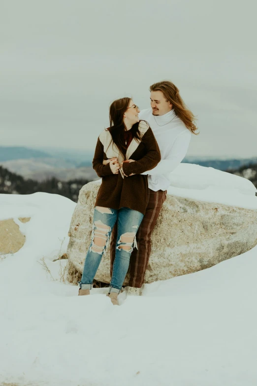 the two beautiful young women are hugging each other