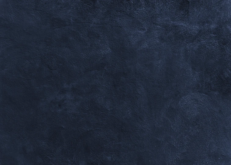 a navy blue wallpaper that has a dark stain and dark colors
