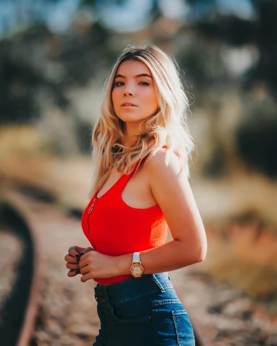 a young woman with short hair in a red top