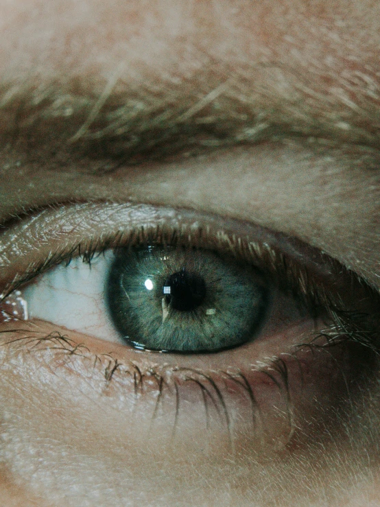 the center section of an eye, with the image of a black eye