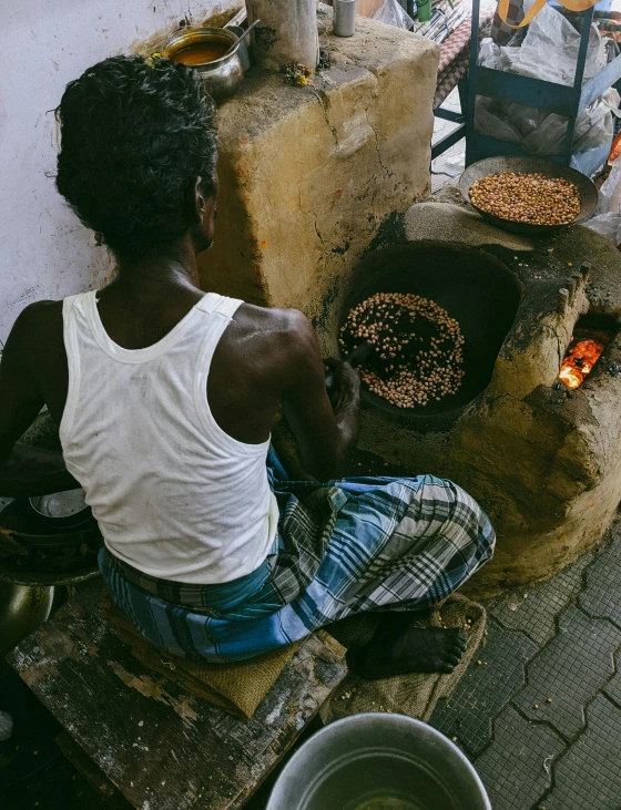 a man is making some kind of  pizza