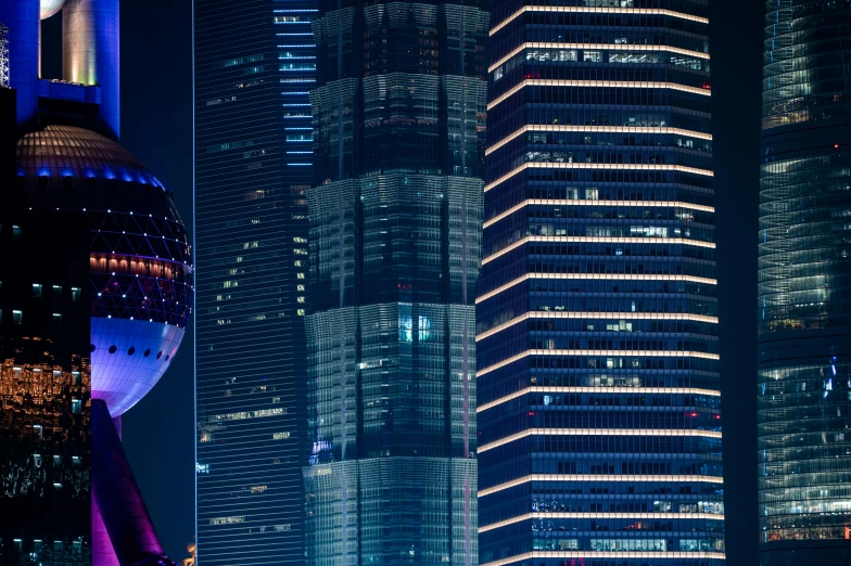 a large skyline at night with lights lit up