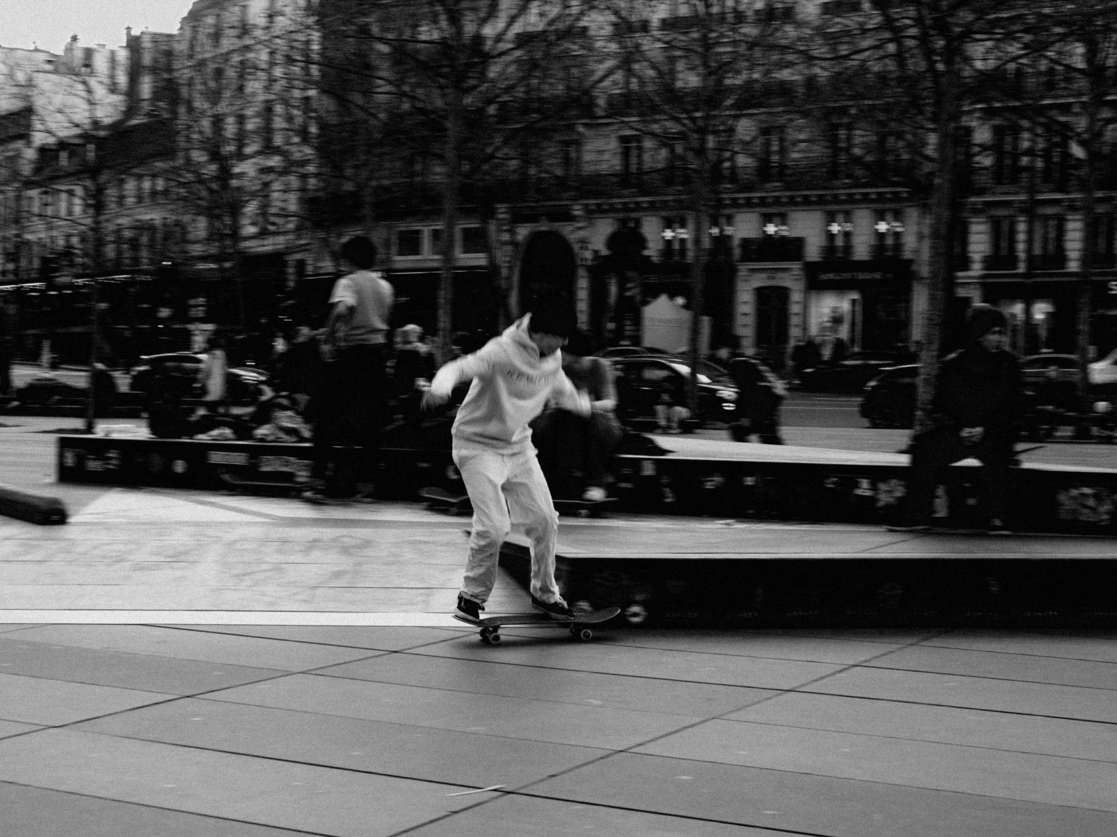 a person riding a skate board on a city street