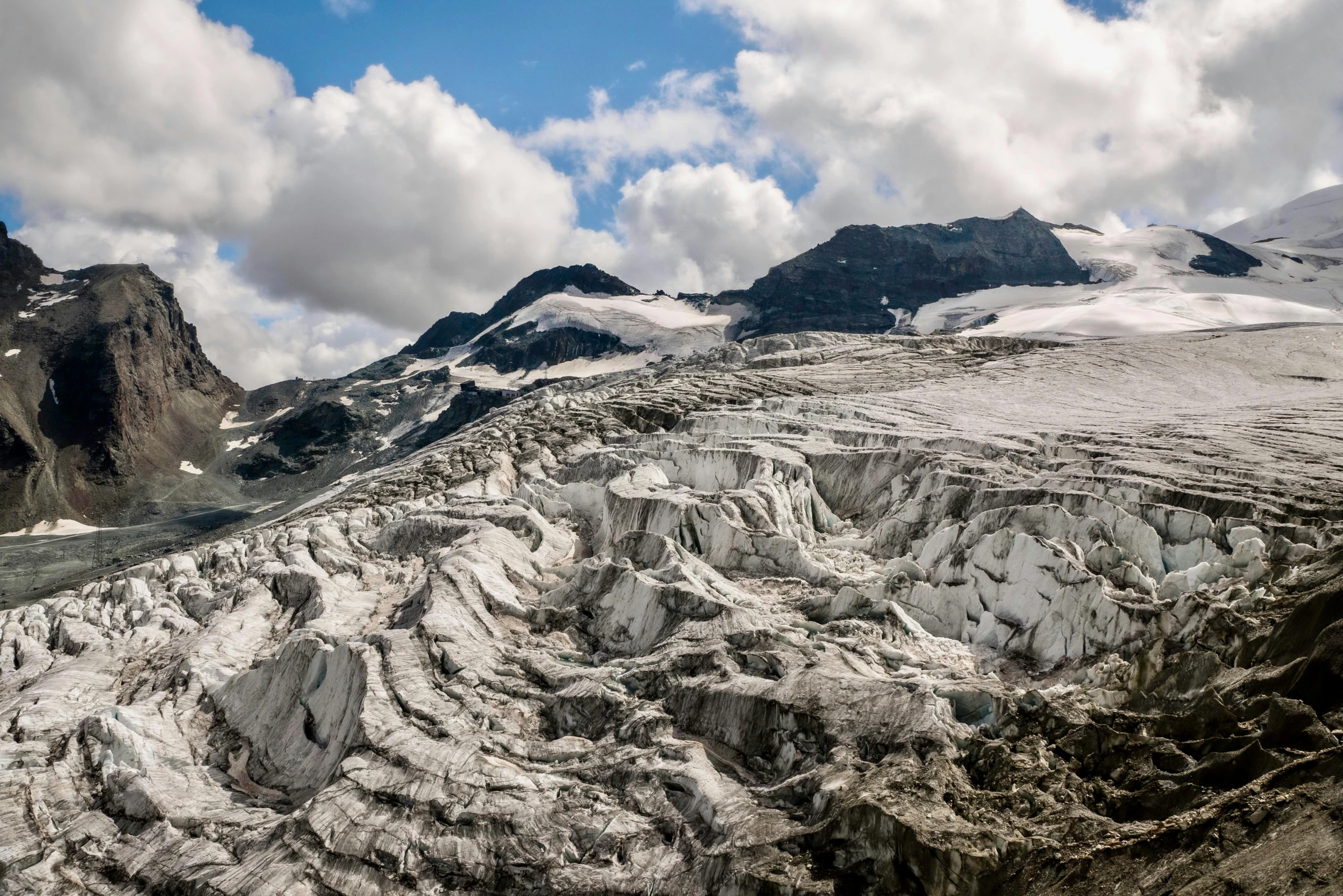 view of snow covered mountains and the sky