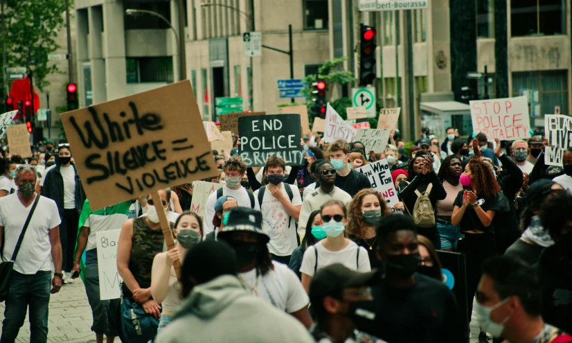 a bunch of people standing on the street