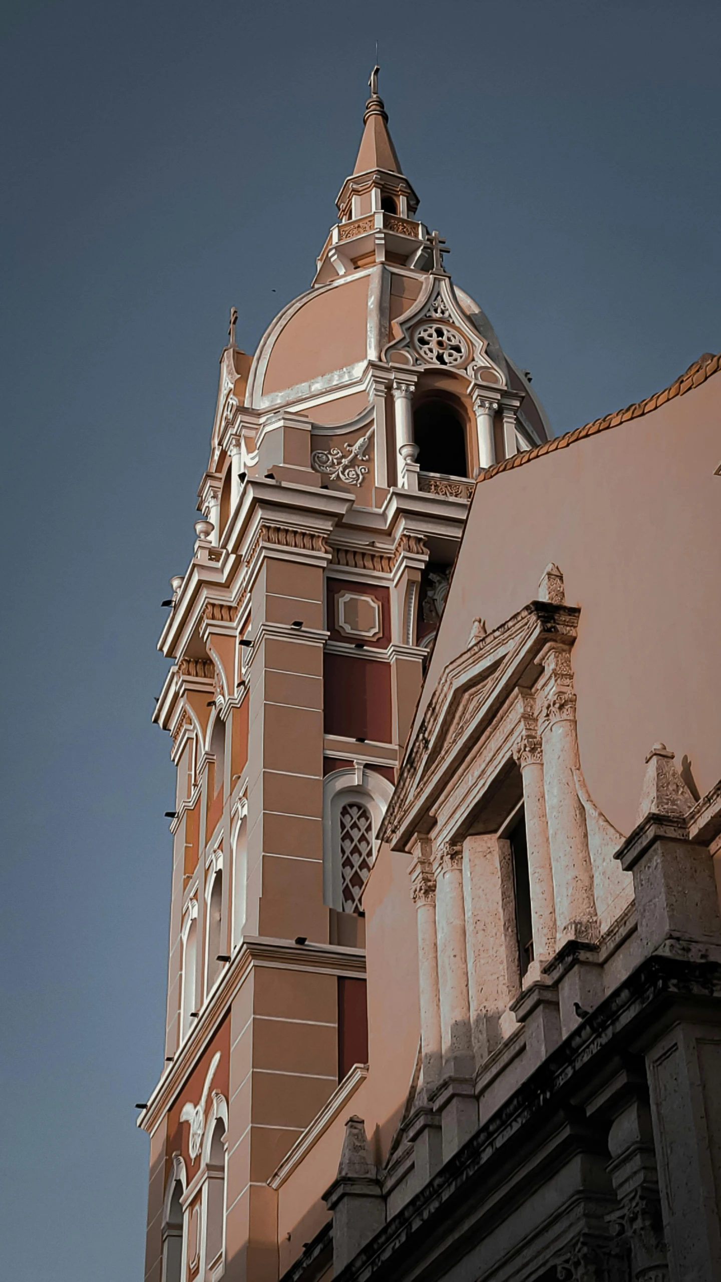 a tall building has a clock on the tower