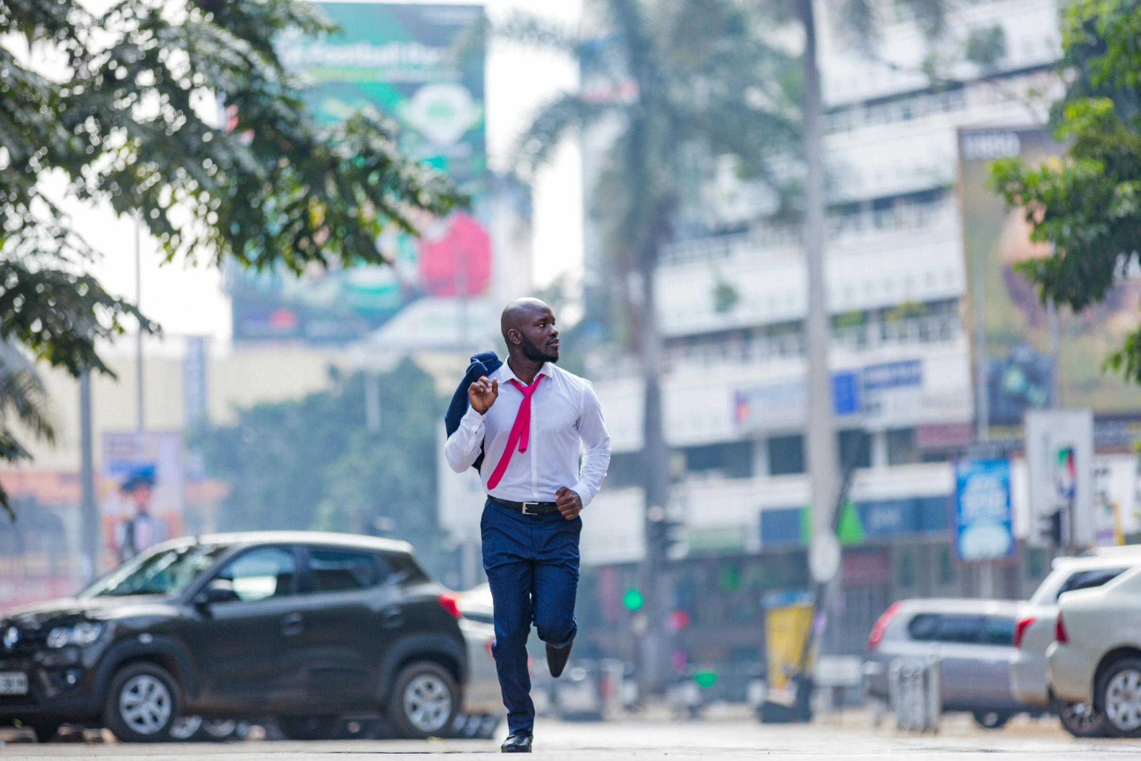 the man in the tie is running on the street