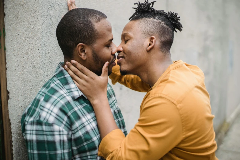 two african men touching each other's noses