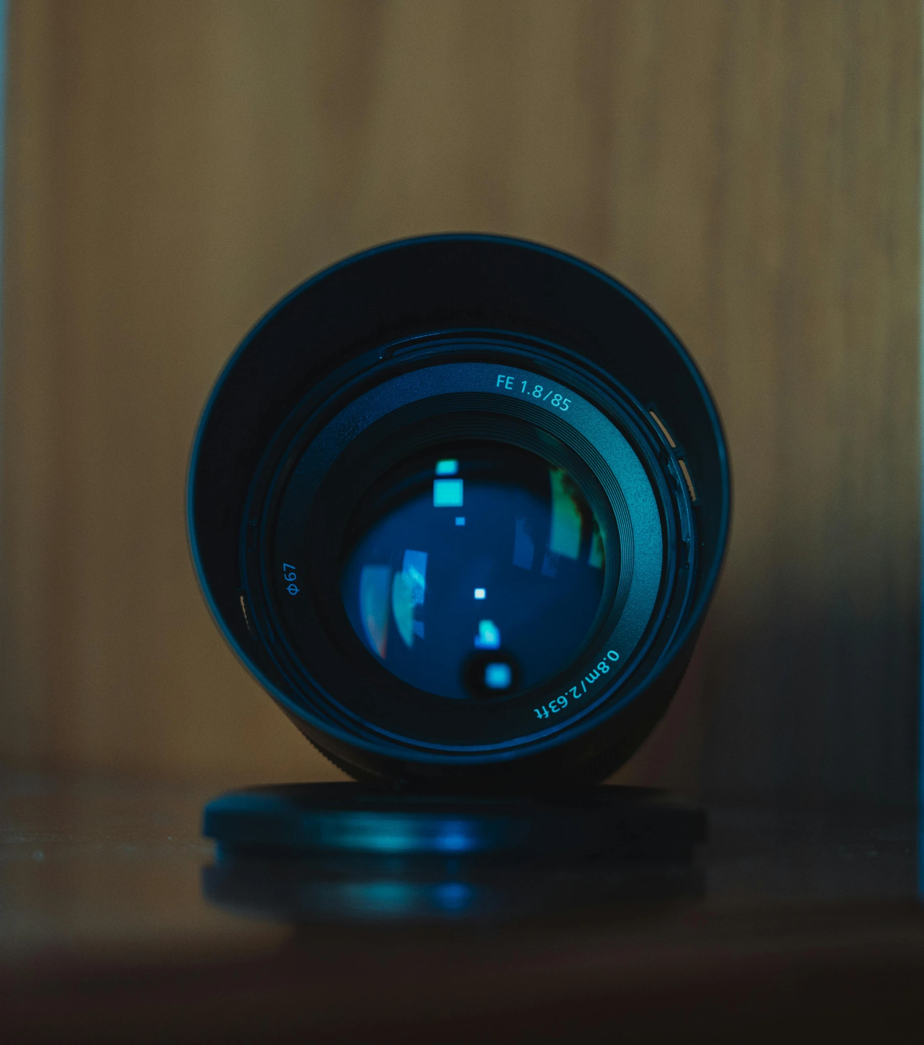 a close up of a lens sitting on top of a wooden table