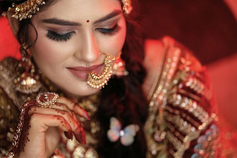 a beautiful young woman wearing an ornate head piece