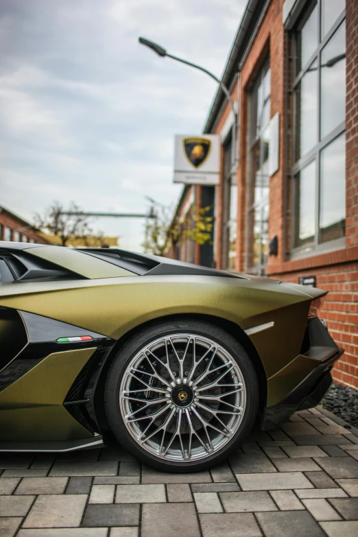 a luxury car sits parked on the pavement