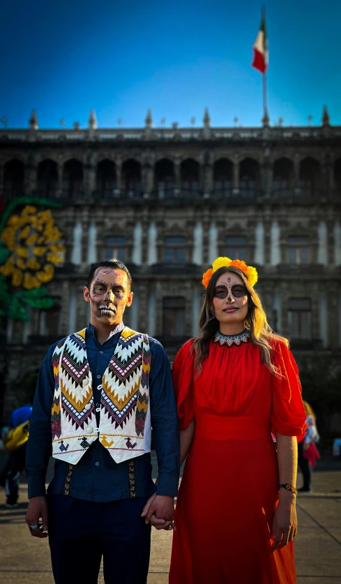 a man and woman in costumes standing together