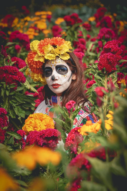 a woman with face paint and flowers painted on her