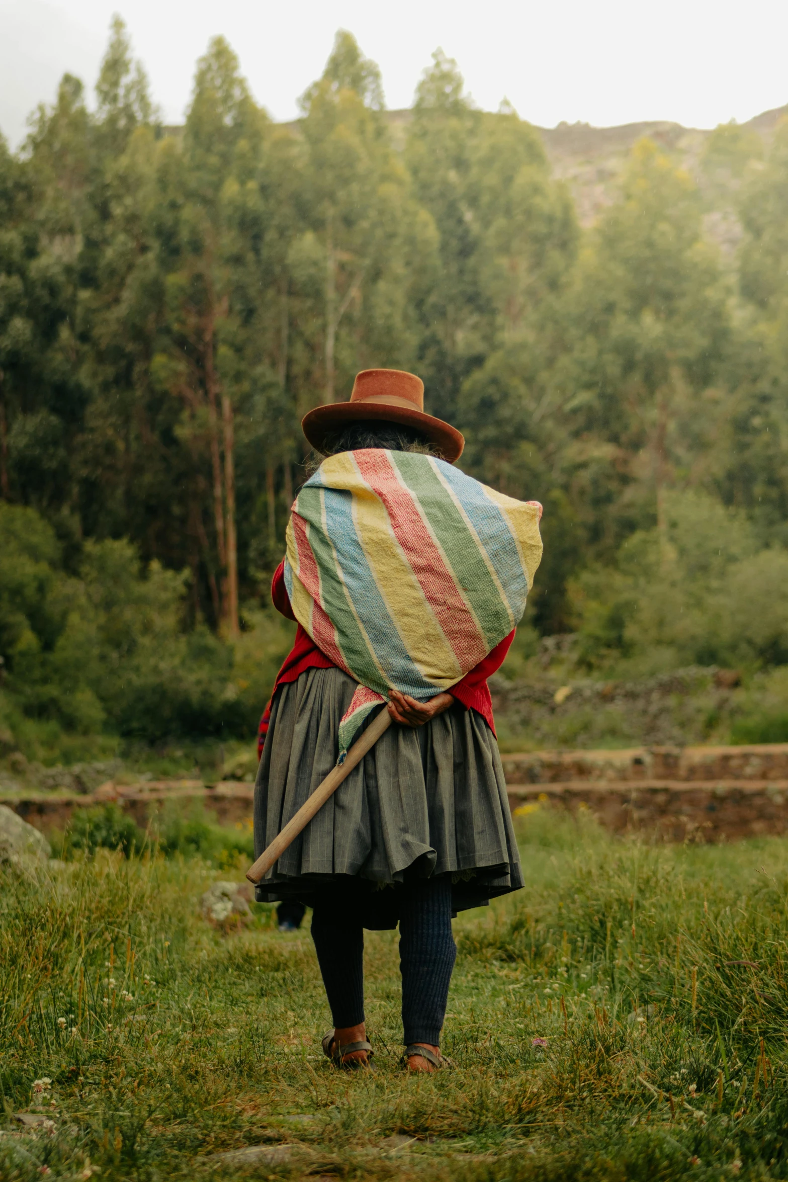 a woman holding onto a large piece of cloth