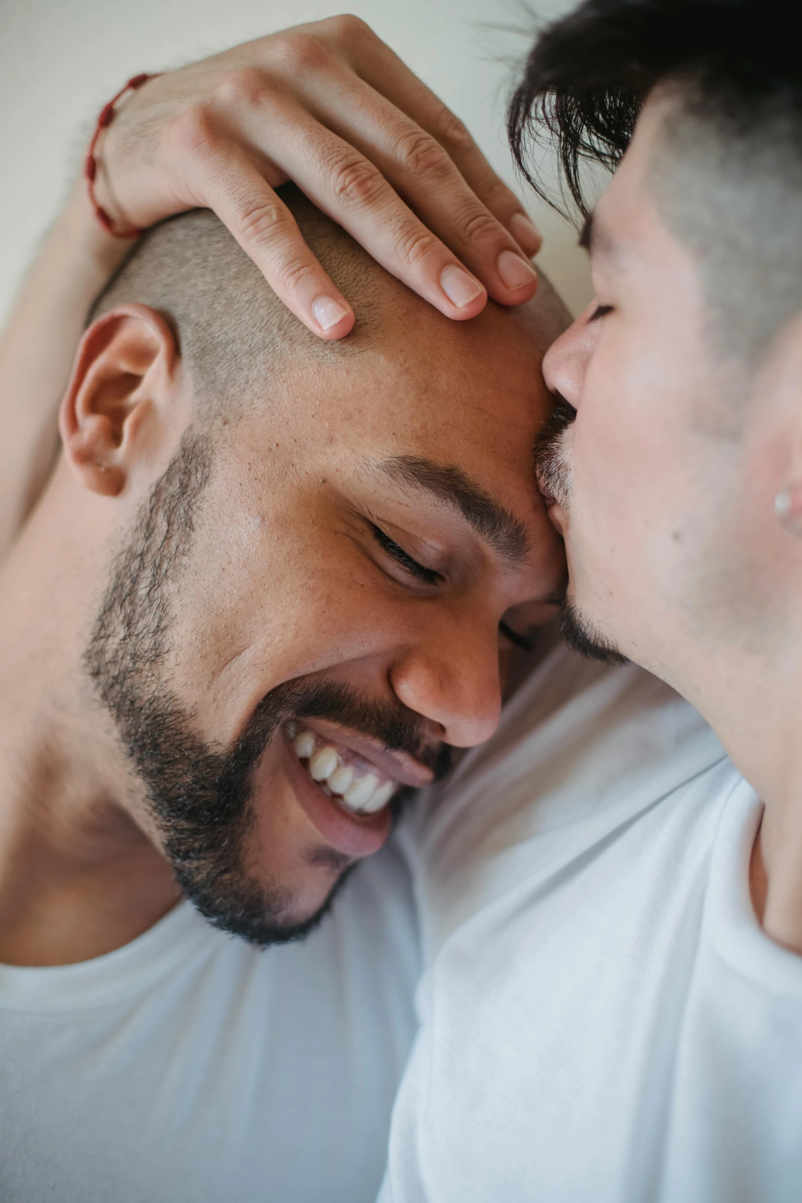 two men emcing each other in a hug