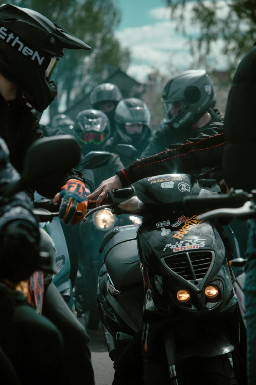 a large group of people on motor bikes