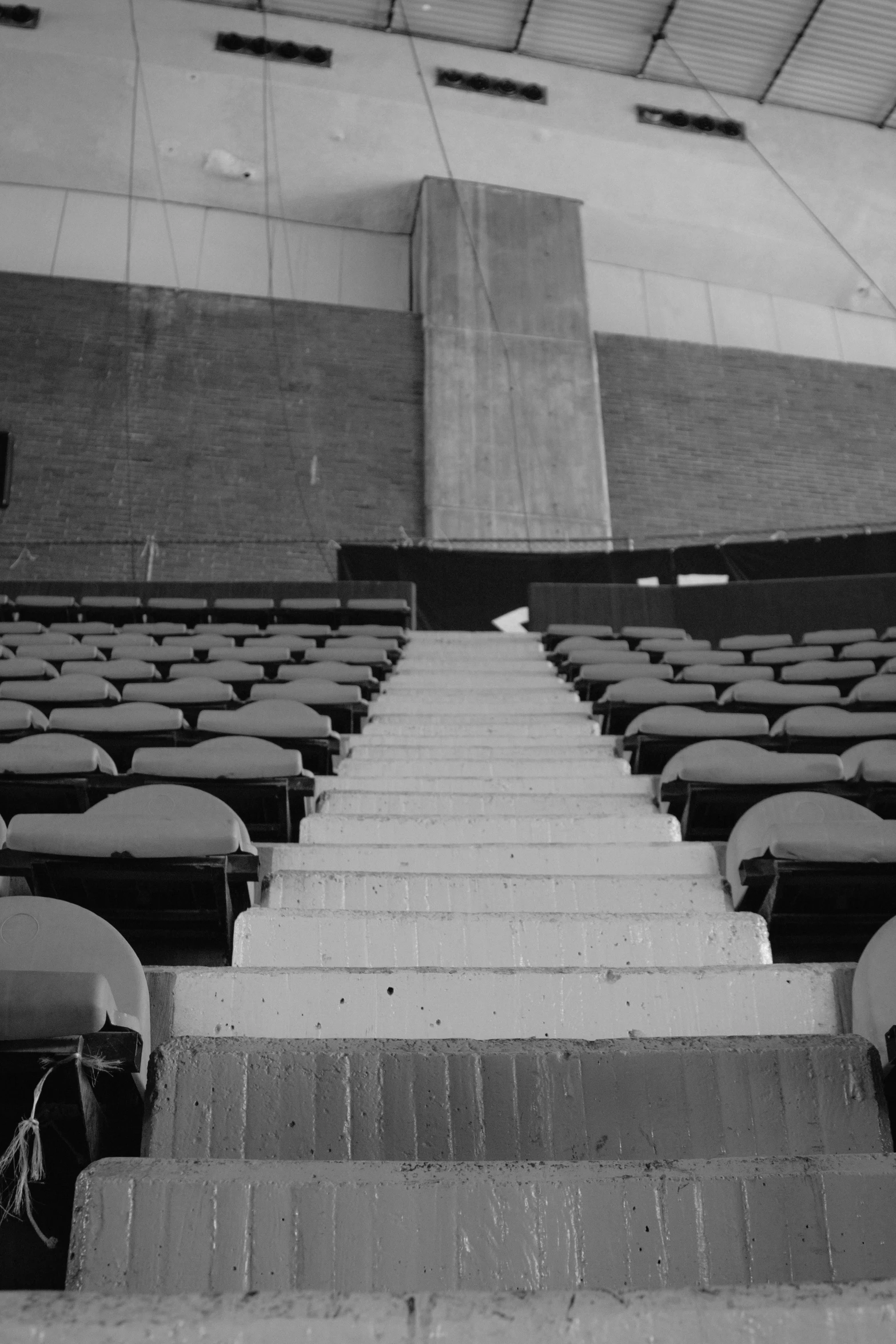 there is a lot of seats and stairs in the auditorium