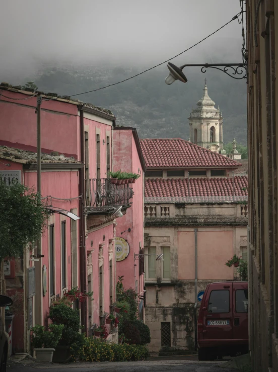 two people standing on a ladder in a street