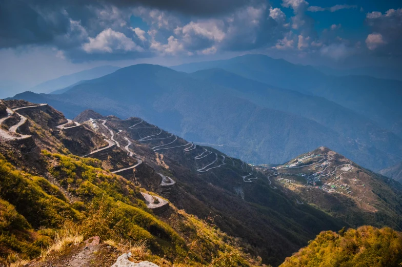 a bunch of dirt roads leading to mountains