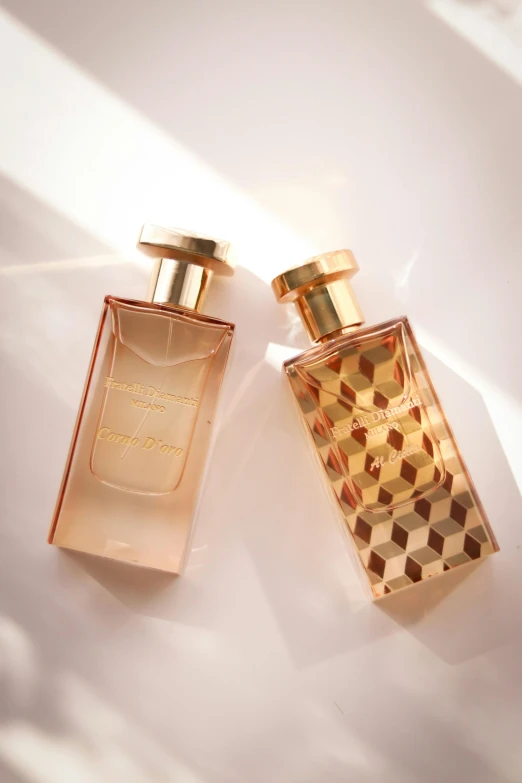 the two perfumes are placed side by side