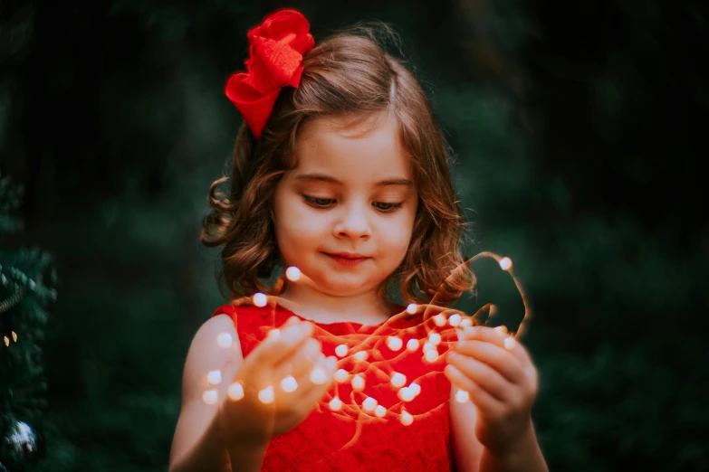  with red dress and lights in her hands