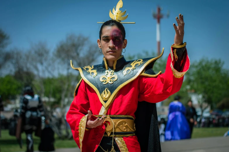 a man is dressed up like a wizard with a golden crown