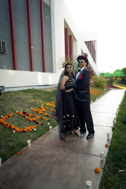 a couple dressed up in a mexican inspired halloween costume posing for the camera